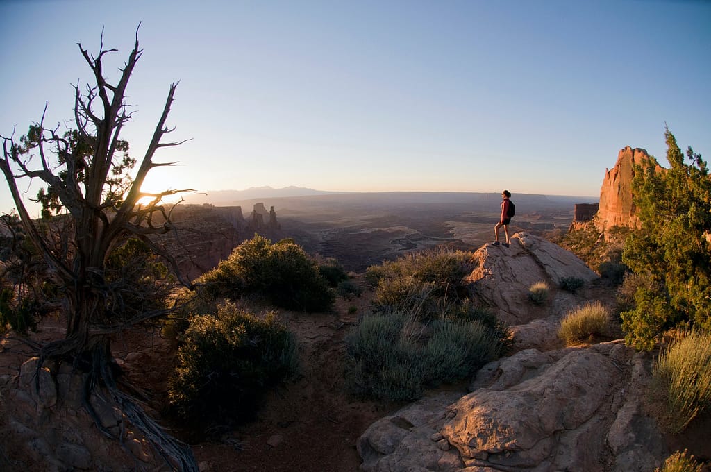 Hiker exploring rock formations, Exploring Off-the-Beaten-Path Destinations. Hidden Gems