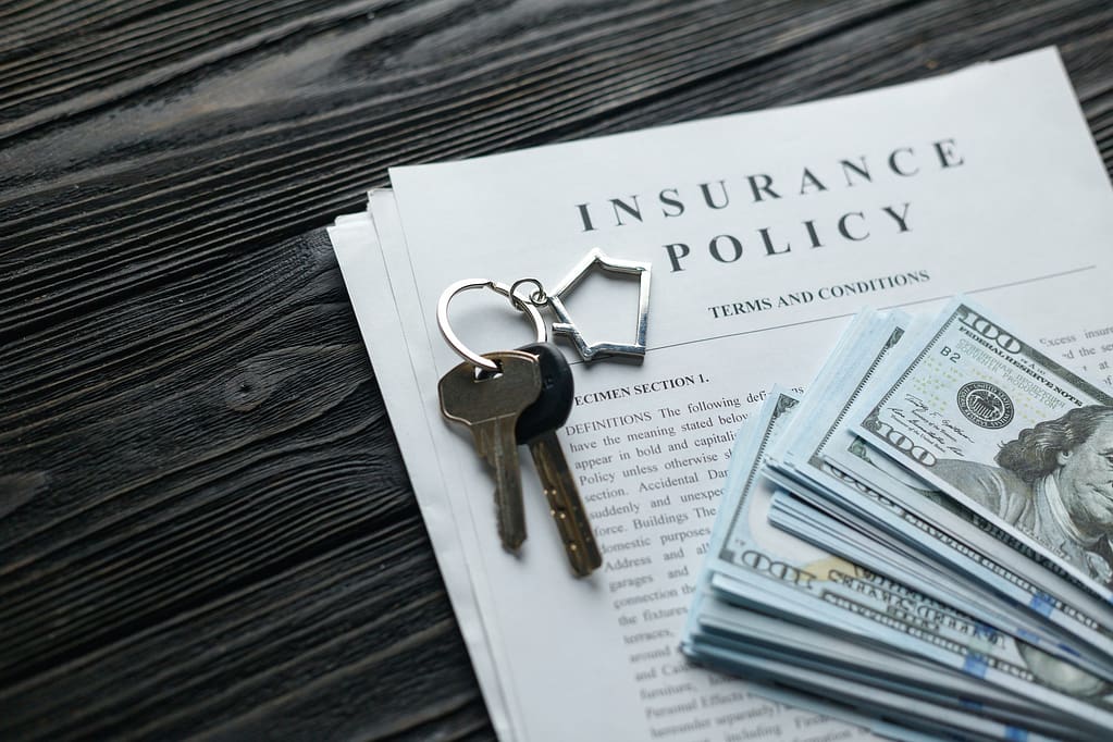 Homeowner's Insurance Policies
Home insurance policy with keys and dollar money mortgage, loan or home insurance documents