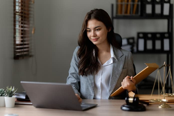 Lawyer business woman working or reading agreement contract in office workplace for consultant